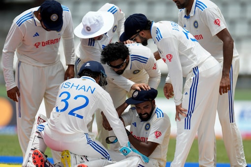 IND vs WI: India players surround Mohammed Siraj (AP)